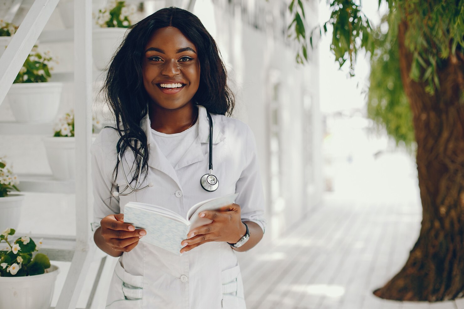 Smiling healthcare professional wearing a stethoscope